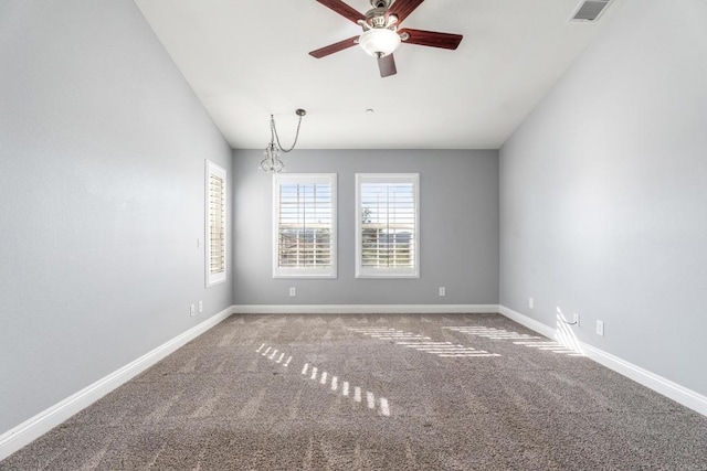 carpeted spare room featuring ceiling fan