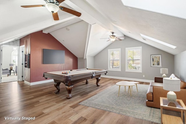 recreation room with hardwood / wood-style floors, billiards, ceiling fan, and vaulted ceiling with skylight