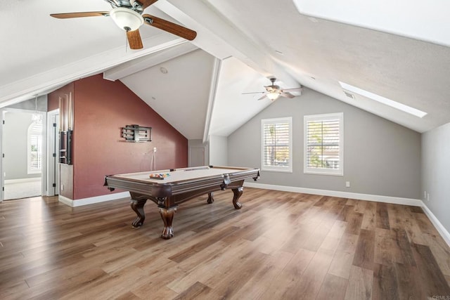 rec room featuring wood-type flooring, lofted ceiling with skylight, ceiling fan, and billiards