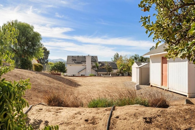 view of yard with a storage unit