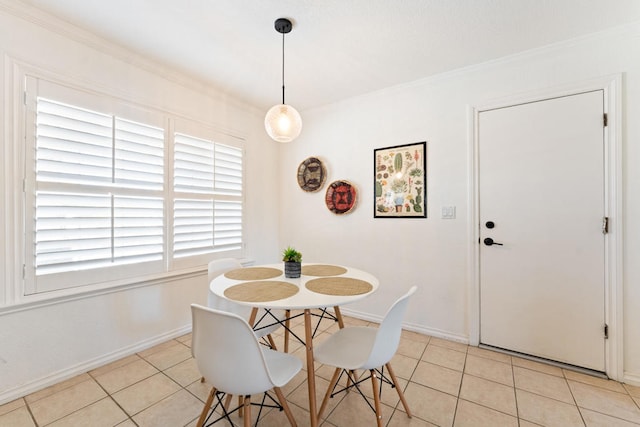 tiled dining room with crown molding