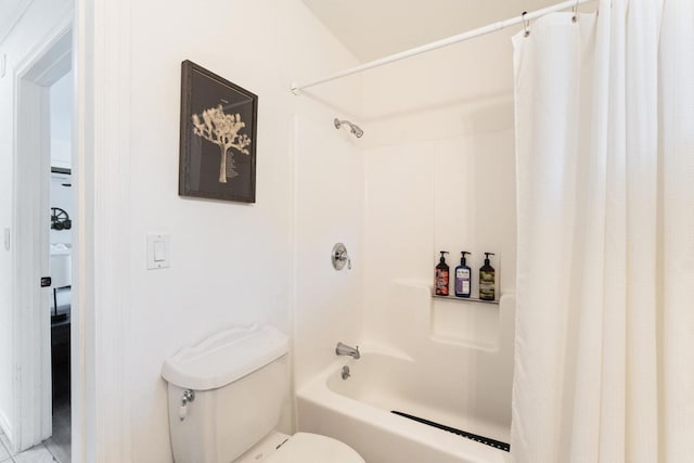 bathroom featuring shower / bath combination with curtain, toilet, and tile patterned floors