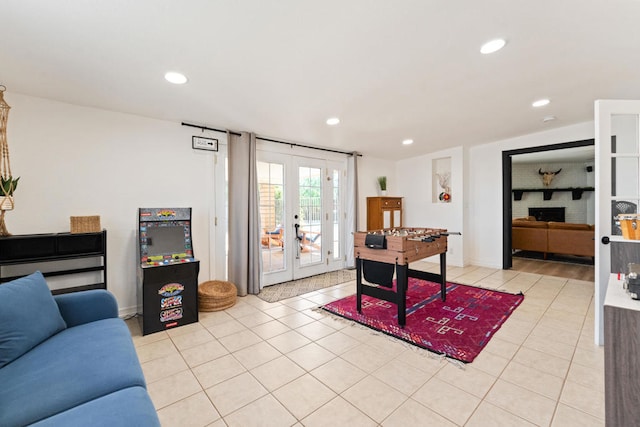 living room with french doors and light tile patterned floors