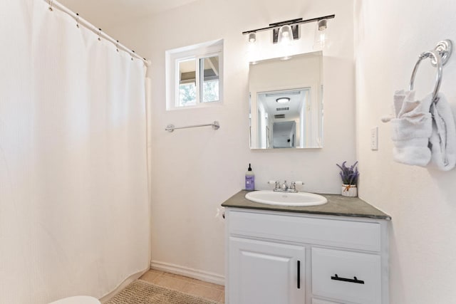 bathroom with vanity and tile patterned flooring