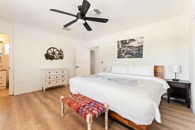 bedroom with crown molding, light hardwood / wood-style flooring, and ceiling fan