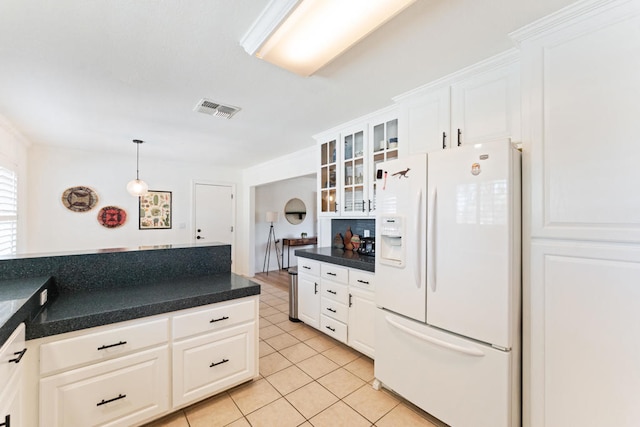 kitchen featuring white cabinets, decorative light fixtures, white refrigerator with ice dispenser, and light tile patterned floors