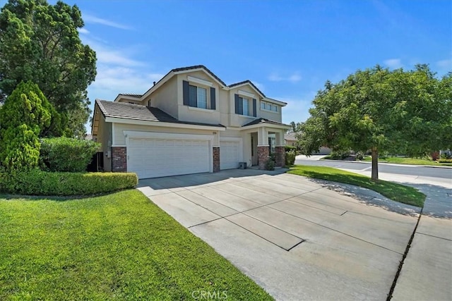 view of front facade featuring a garage, stucco siding, concrete driveway, and a front yard