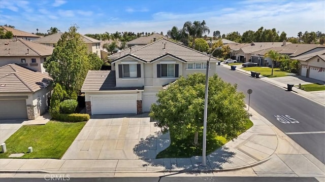 view of front facade featuring stucco siding, a garage, a residential view, driveway, and a tiled roof