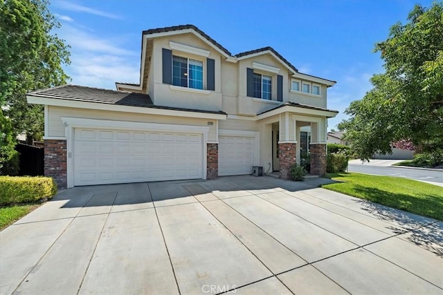 view of front of house featuring a garage, a tile roof, concrete driveway, and brick siding