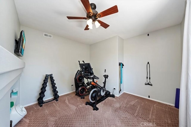 workout room with ceiling fan, carpet flooring, visible vents, and baseboards