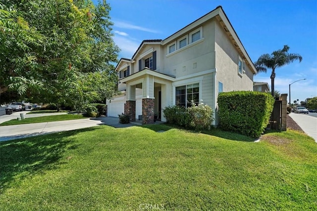 view of front of house featuring an attached garage, concrete driveway, a front yard, and stucco siding