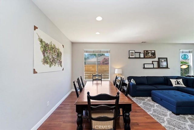 dining area with recessed lighting, baseboards, a wealth of natural light, and wood finished floors