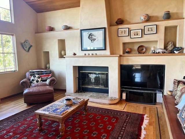 living room with lofted ceiling and hardwood / wood-style floors