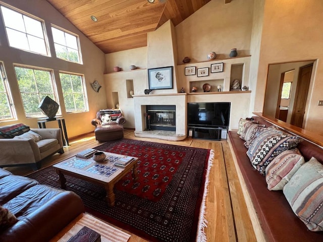 living room featuring high vaulted ceiling, wood-type flooring, and wooden ceiling