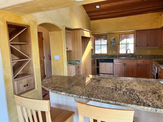 kitchen featuring sink, wood ceiling, stone countertops, dishwasher, and kitchen peninsula