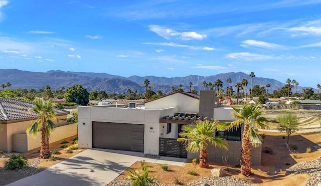 view of front of home featuring a mountain view and a garage