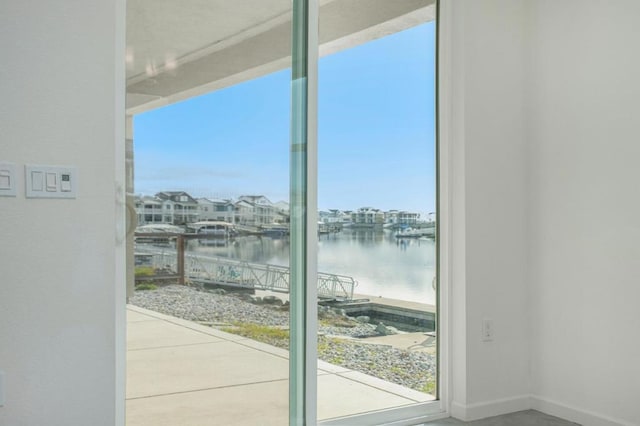 doorway to outside featuring a water view