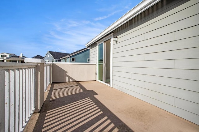 view of patio featuring a balcony