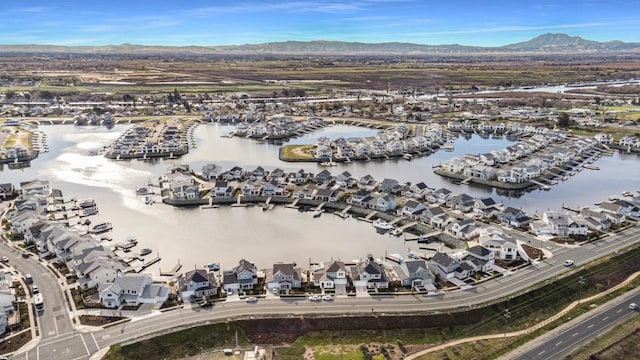 bird's eye view featuring a water and mountain view