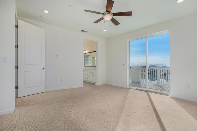 carpeted empty room featuring ceiling fan