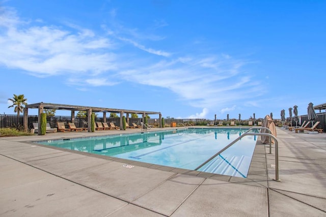 view of swimming pool featuring a patio area