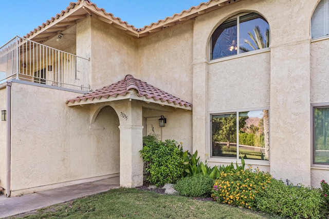 doorway to property featuring a balcony