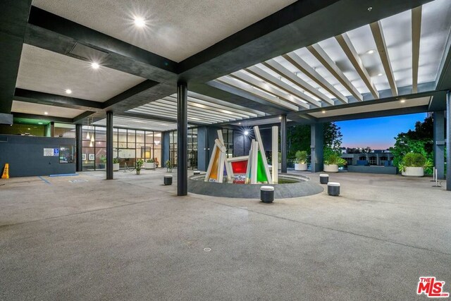 view of garage at dusk