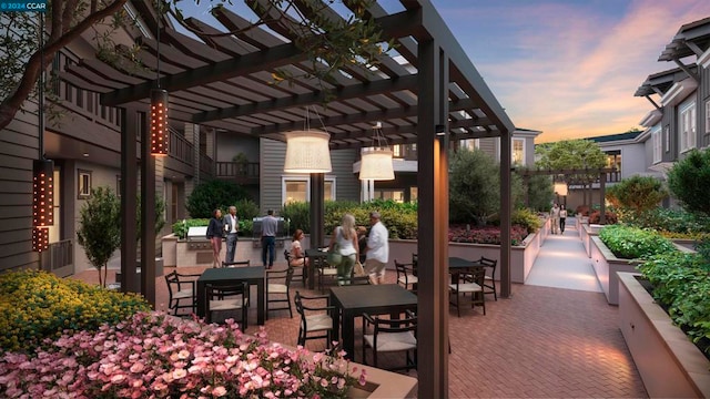 patio terrace at dusk featuring a pergola