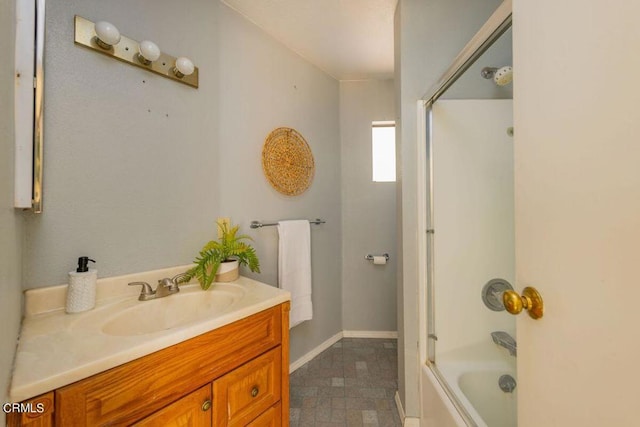 bathroom with vanity and bathtub / shower combination