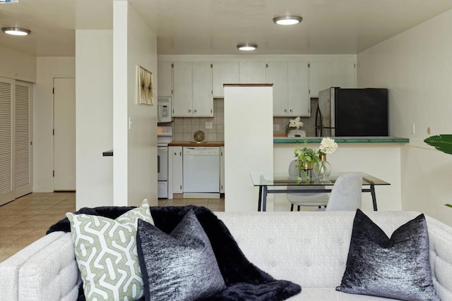 living room with light tile patterned flooring