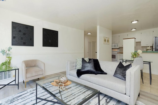 living room with light hardwood / wood-style flooring