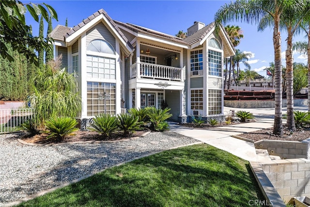 view of front of home with a balcony