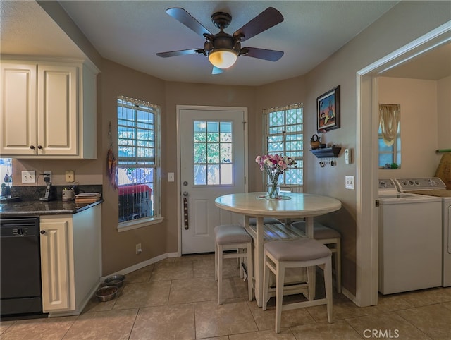 dining space featuring ceiling fan, light tile patterned flooring, and washer and clothes dryer