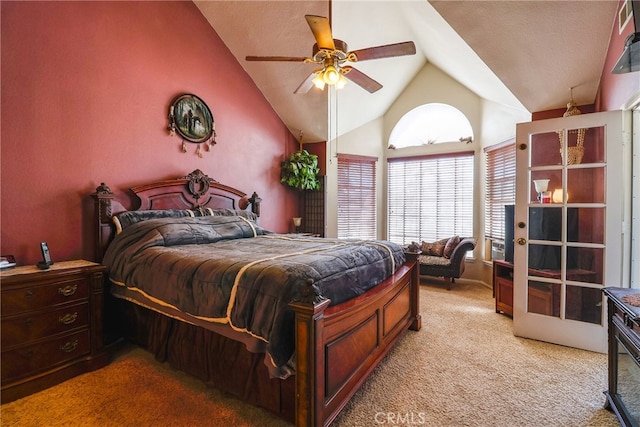 carpeted bedroom with high vaulted ceiling and ceiling fan