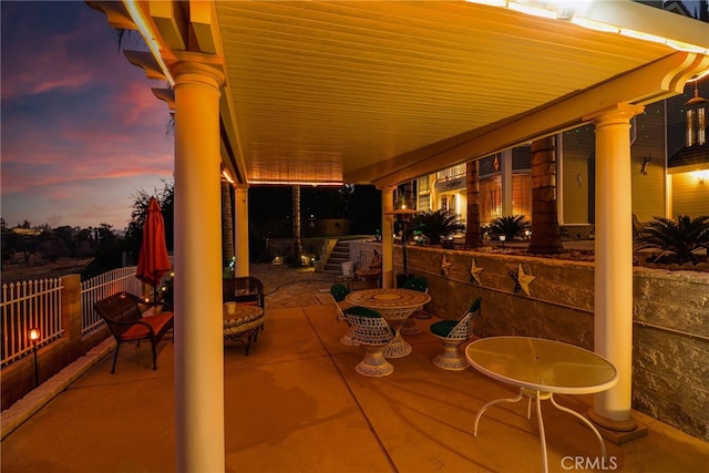 view of patio terrace at dusk