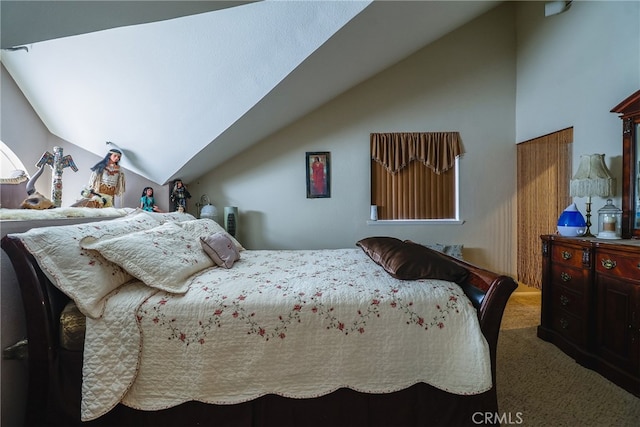 carpeted bedroom with vaulted ceiling