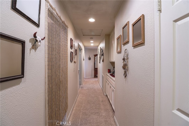 hallway with light carpet