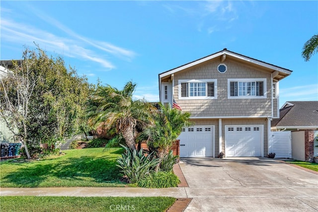 view of front of house featuring a garage and a front yard