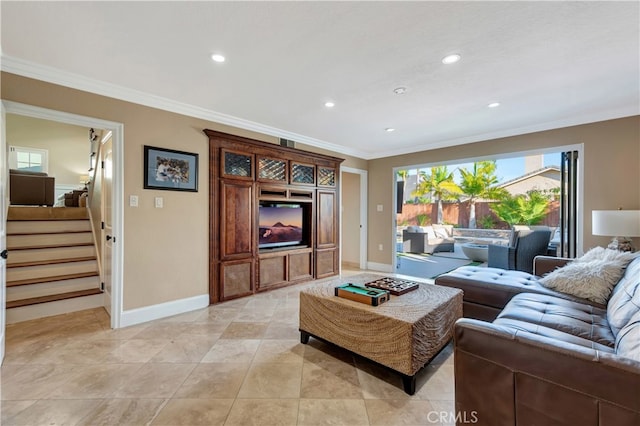 living room with a fireplace and ornamental molding