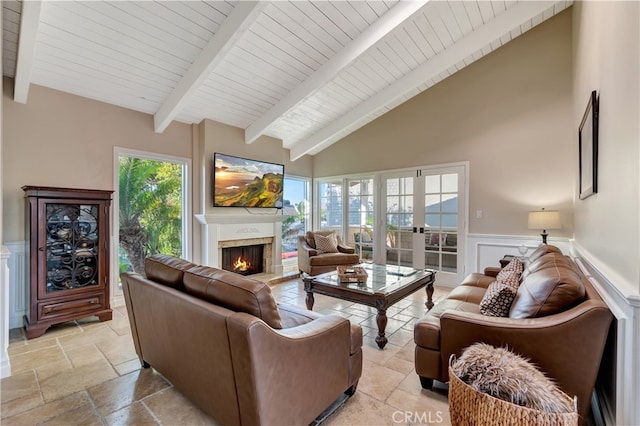 living room featuring beamed ceiling, high vaulted ceiling, and wooden ceiling