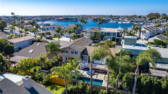 birds eye view of property featuring a water view