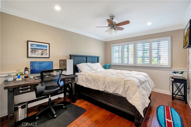 bedroom featuring crown molding, dark hardwood / wood-style floors, and ceiling fan