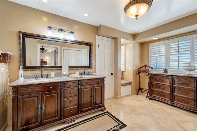 bathroom featuring vanity, ceiling fan, and tile patterned floors