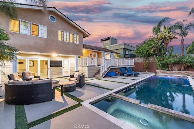 view of pool with an in ground hot tub, a patio area, and outdoor lounge area