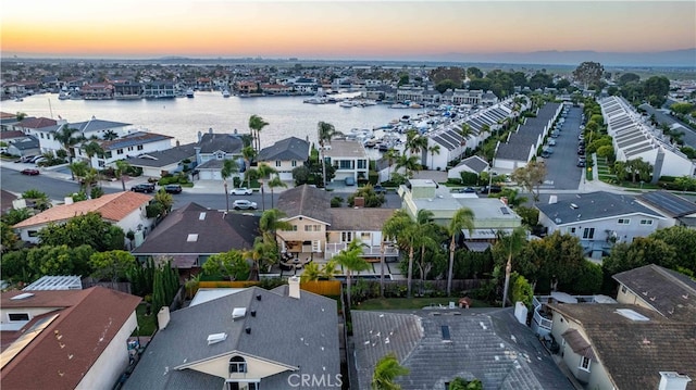 aerial view at dusk with a water view