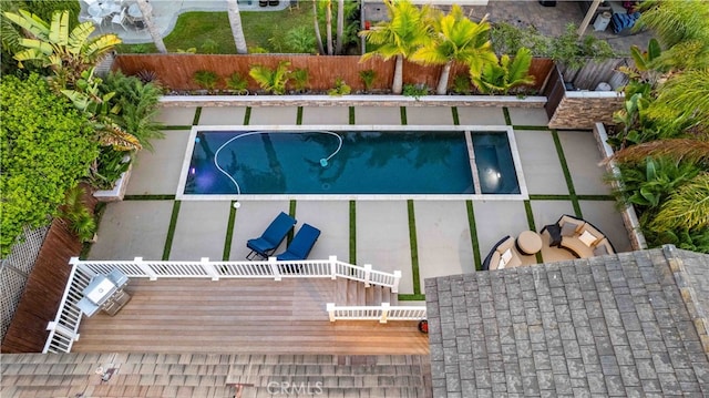 view of swimming pool featuring a wooden deck