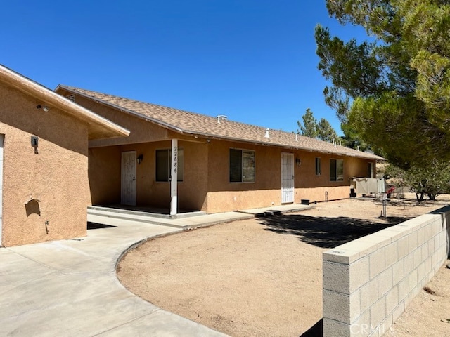 rear view of property featuring a patio area