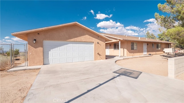 ranch-style house featuring a garage