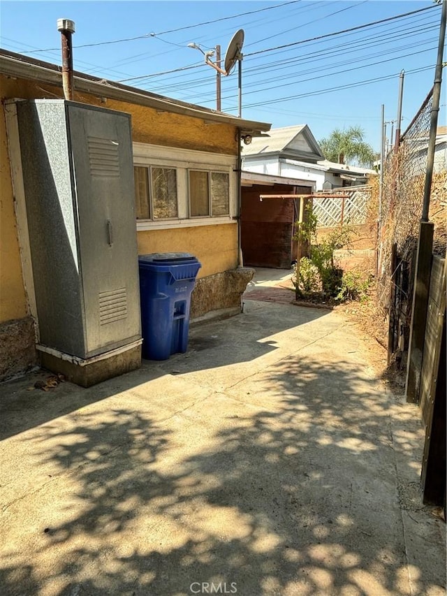 view of side of property featuring a patio