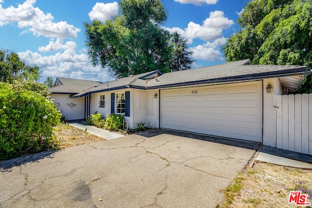 ranch-style house featuring a garage